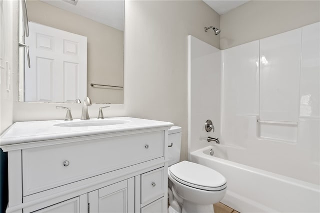 full bathroom with shower / tub combination, vanity, and toilet