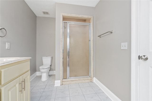 bathroom featuring vanity, toilet, and walk in shower