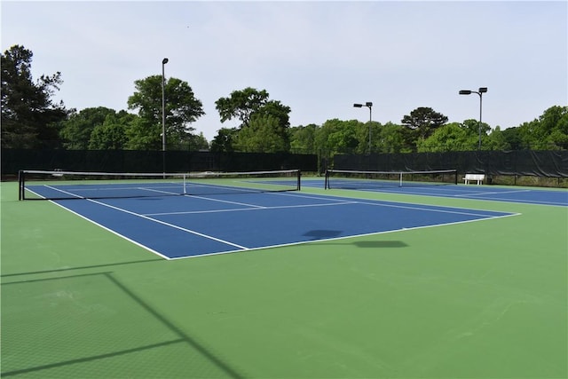view of sport court with fence and community basketball court
