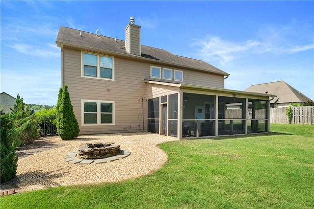 197 Westover St, Auburn, AL 36832 - back of property with a fire pit, a chimney, and a sunroom