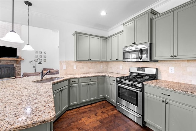 197 Westover St, Auburn, AL 36832 - kitchen featuring appliances with stainless steel finishes, gray cabinets, dark wood finished floors, light stone countertops, and recessed lighting