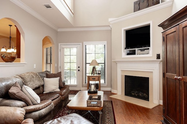 1986 Stephanie Ct Unit Lt64, Auburn, AL 36830 - living area with wood finished floors, a chandelier, crown molding, arched walkways, and vaulted ceiling
