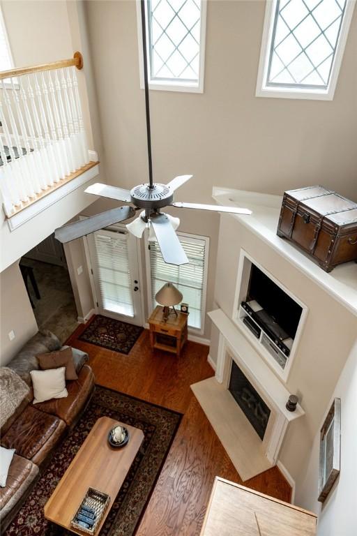 1986 Stephanie Ct Unit Lt64, Auburn, AL 36830 - living area with wood finished floors, a ceiling fan, and a towering ceiling