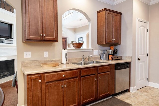 1986 Stephanie Ct Unit Lt64, Auburn, AL 36830 - kitchen with dishwasher, crown molding, light countertops, arched walkways, and brown cabinets