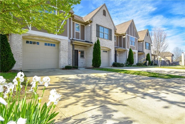 2046 Stephanie Ct, Auburn, AL 36830 - view of front of home with driveway, a garage, a residential view, and brick siding