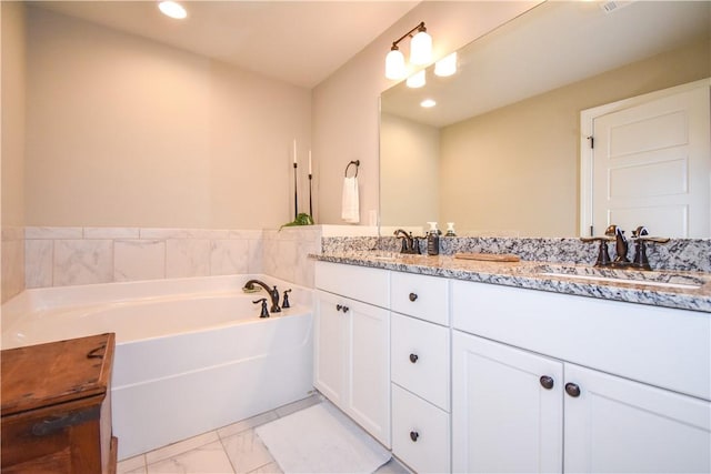 2046 Stephanie Ct, Auburn, AL 36830 - bathroom with marble finish floors, double vanity, a bath, and recessed lighting