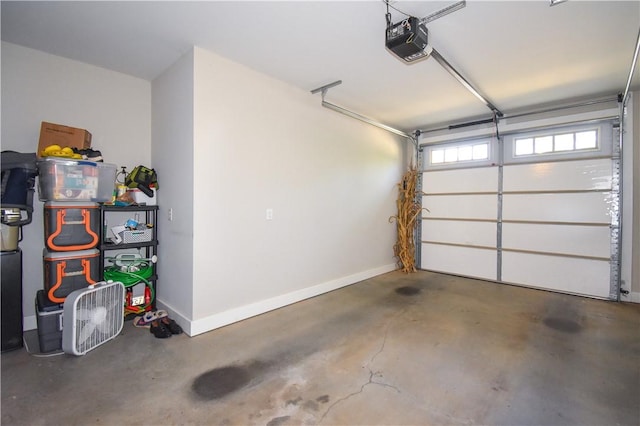 2046 Stephanie Ct, Auburn, AL 36830 - garage featuring a garage door opener and baseboards
