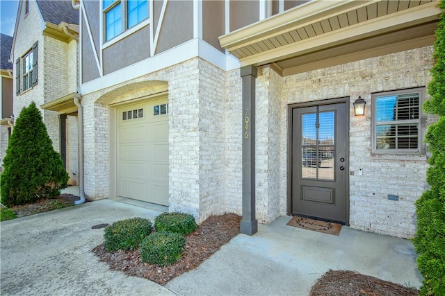 2046 Stephanie Ct, Auburn, AL 36830 - entrance to property with a garage, brick siding, stucco siding, and stone siding