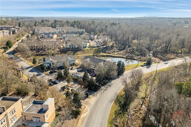 drone / aerial view with a residential view and a water view