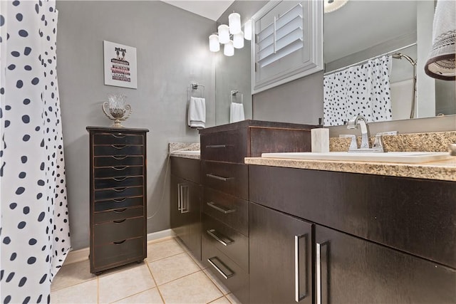 bathroom featuring curtained shower, tile patterned flooring, and vanity