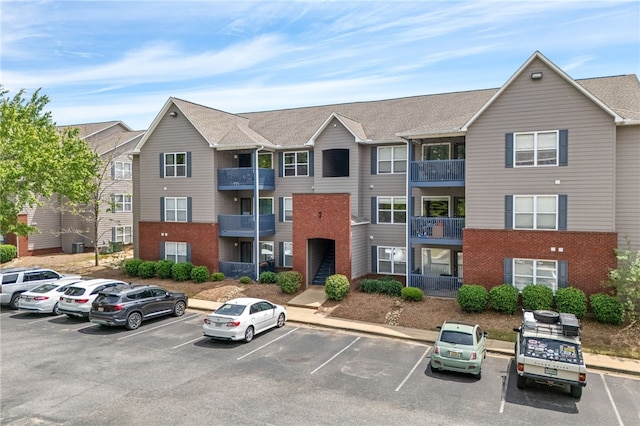 1114 S College St Unit 302, Auburn, AL 36830 - view of building exterior with uncovered parking