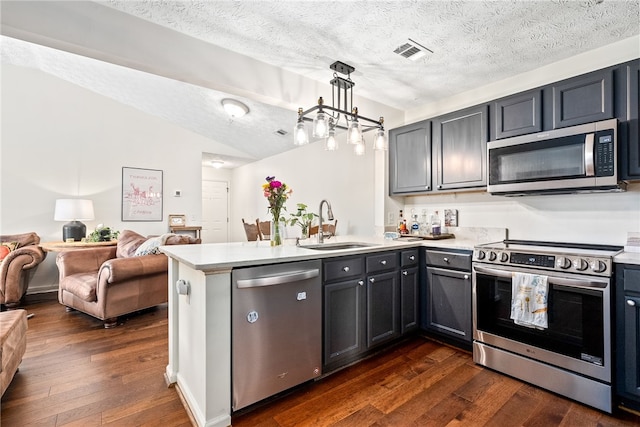 1114 S College St Unit 302, Auburn, AL 36830 - kitchen with a peninsula, visible vents, appliances with stainless steel finishes, and dark wood finished floors