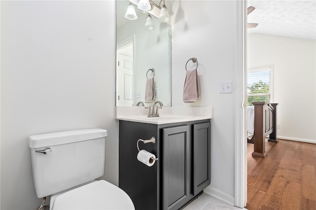 1114 S College St Unit 302, Auburn, AL 36830 - bathroom with toilet, lofted ceiling, vanity, and baseboards