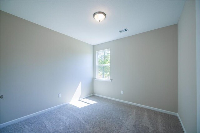 unfurnished room with carpet