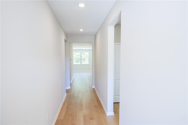 corridor featuring light hardwood / wood-style floors