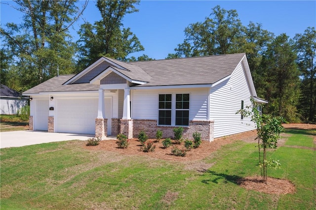 view of front of house with a garage and a front lawn