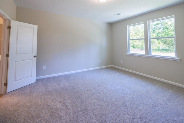 view of carpeted spare room