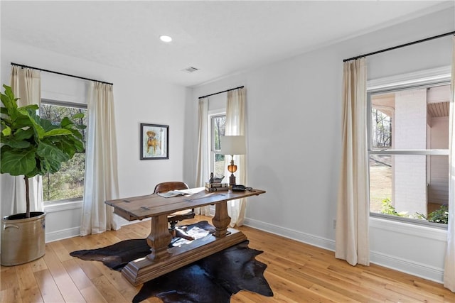 home office with light wood-style flooring, baseboards, visible vents, and recessed lighting
