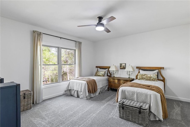bedroom featuring baseboards, ceiling fan, and carpet floors