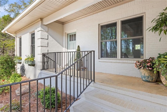 entrance to property with brick siding