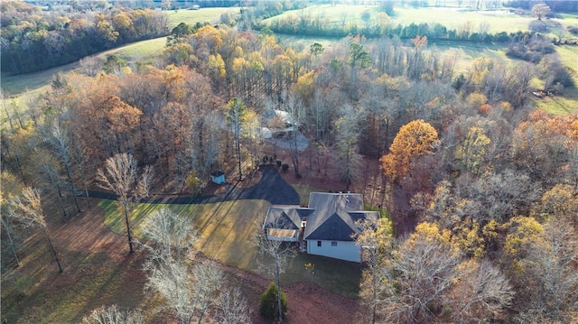 drone / aerial view featuring a forest view