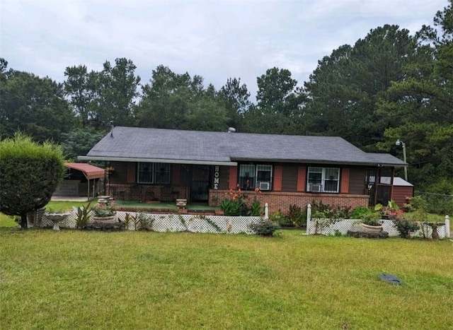 2102 Susie Cir, Tuskegee, AL 36083 - ranch-style home featuring covered porch, a front yard, and brick siding