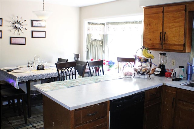 26 Arrowhead Rd, Phenix City, AL 36869 - kitchen with dishwasher, a peninsula, and light countertops
