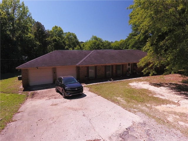 26 Arrowhead Rd, Phenix City, AL 36869 - single story home featuring asphalt driveway, a porch, and an attached garage