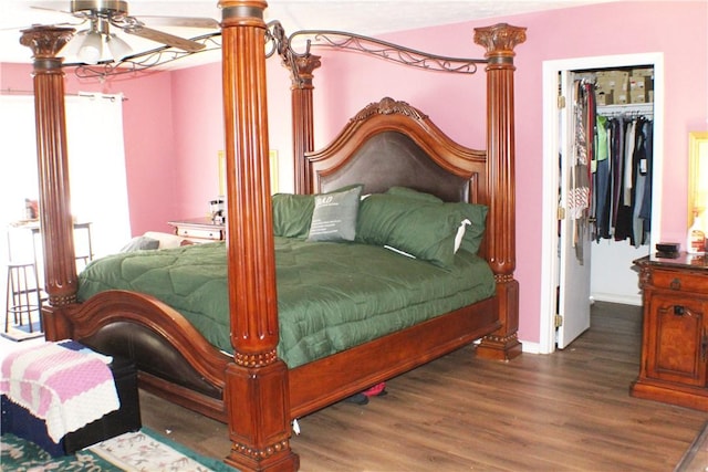 26 Arrowhead Rd, Phenix City, AL 36869 - bedroom featuring a spacious closet, wood finished floors, a closet, and baseboards