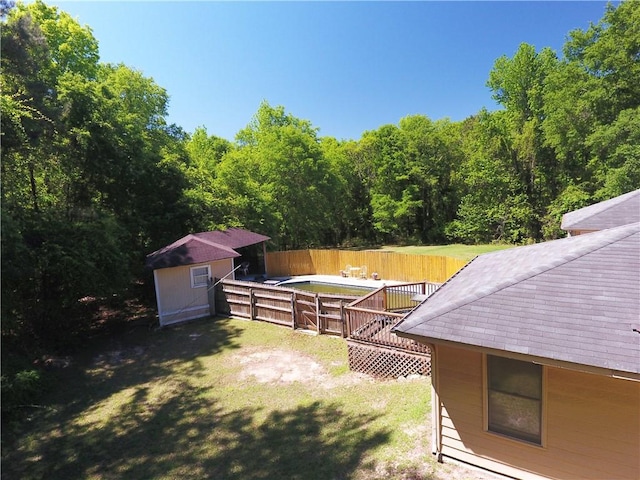 26 Arrowhead Rd, Phenix City, AL 36869 - view of yard with an outbuilding, a shed, and a deck