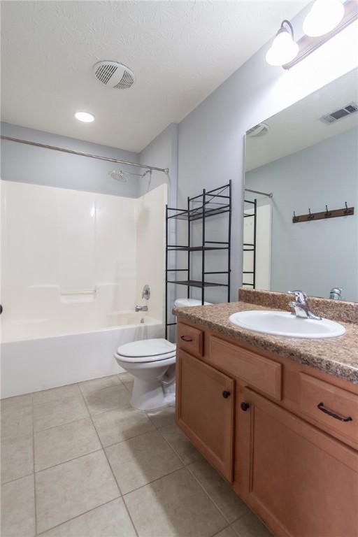 full bath featuring tile patterned flooring, shower / bathing tub combination, toilet, and visible vents