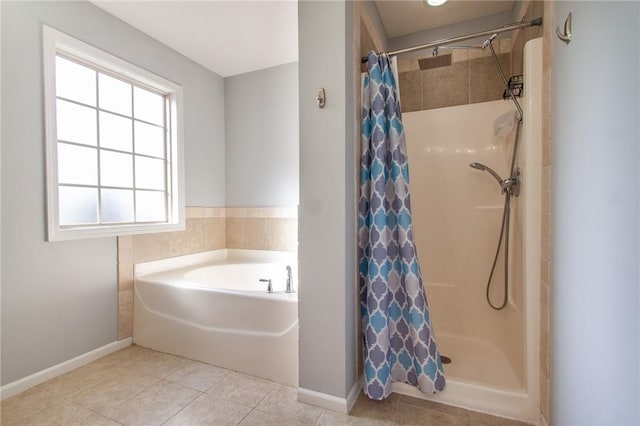 full bathroom featuring tile patterned floors, a stall shower, and a bath