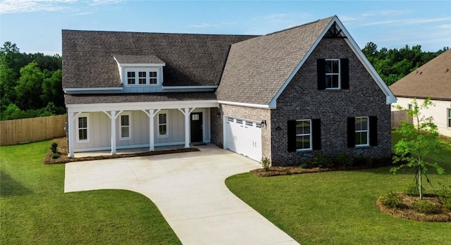 1534 Everly Dr, Opelika, AL 36801 - view of front of property with covered porch, driveway, a garage, a shingled roof, and brick siding