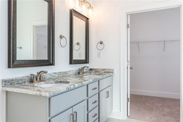 1534 Everly Dr, Opelika, AL 36801 - bathroom with double vanity and a walk in closet