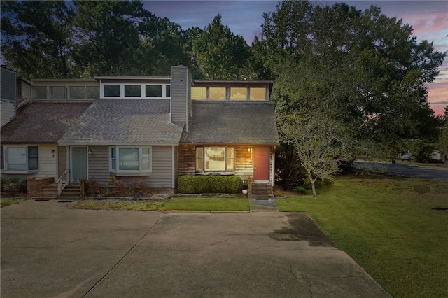 view of front of home featuring a yard