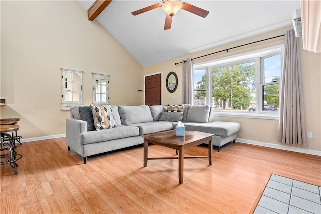 living room featuring beamed ceiling, light wood-type flooring, high vaulted ceiling, and ceiling fan