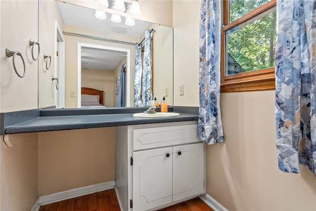 bathroom featuring vanity and wood-type flooring