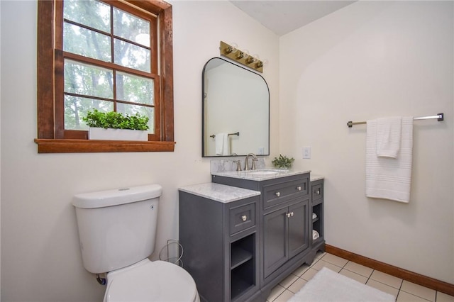 bathroom with tile patterned floors, vanity, and toilet