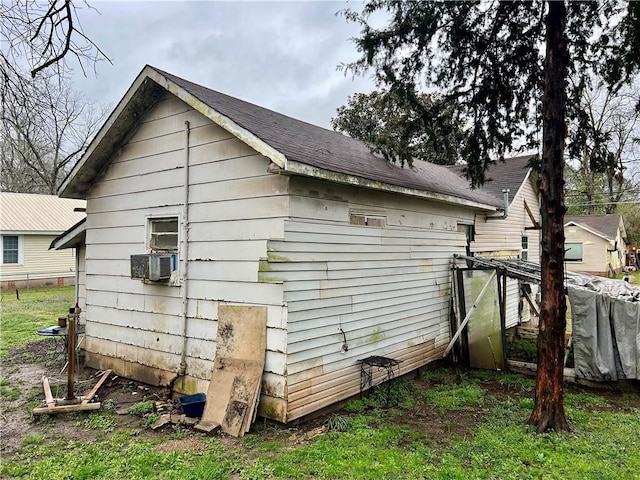 view of side of property featuring cooling unit