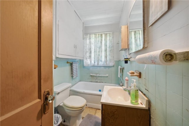 bathroom with a bath, toilet, and vanity