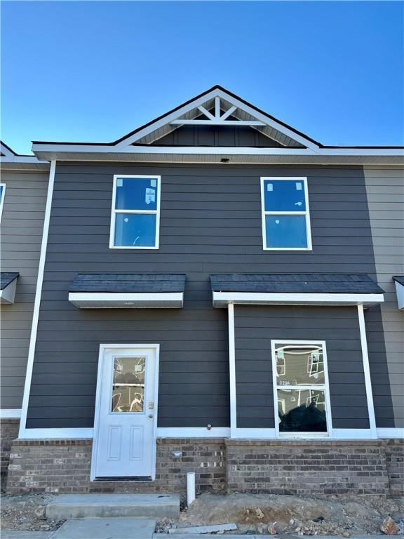 exterior space with stone siding