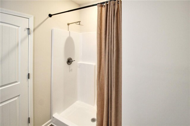 bathroom with a stall shower
