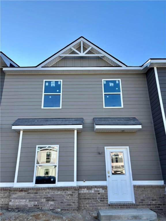 exterior space featuring brick siding