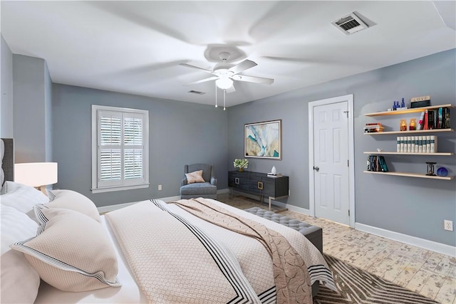 bedroom featuring baseboards, visible vents, and ceiling fan