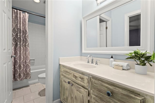 bathroom with shower / tub combo, tile patterned flooring, vanity, and toilet