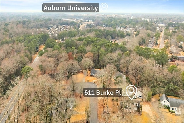 drone / aerial view featuring a forest view