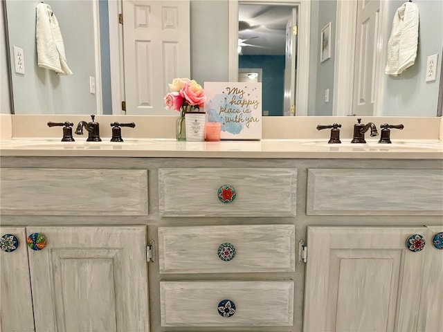 bathroom featuring a ceiling fan and vanity