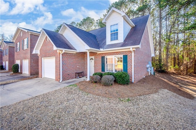 view of front of property with a garage, concrete driveway, and brick siding