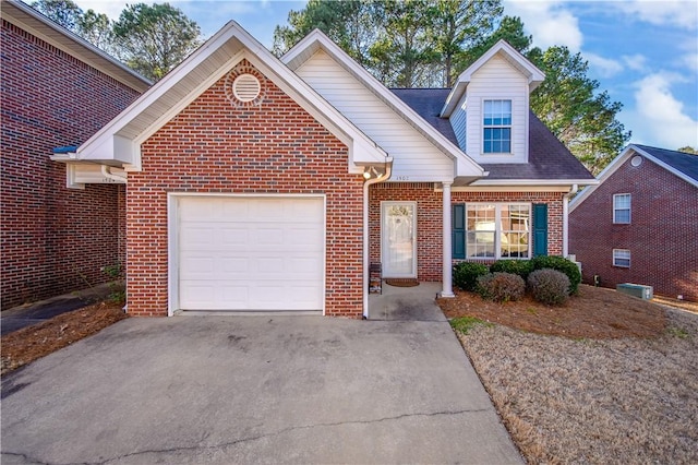 view of front of house featuring concrete driveway, brick siding, and an attached garage