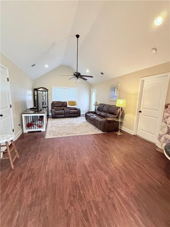 living room with dark hardwood / wood-style floors, ceiling fan, and lofted ceiling